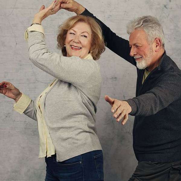  Happy stylish elderly couple dancing and laughing. Vintage image